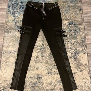 Vegan leather and suede women’s pants with buckets and zippers on pants leg